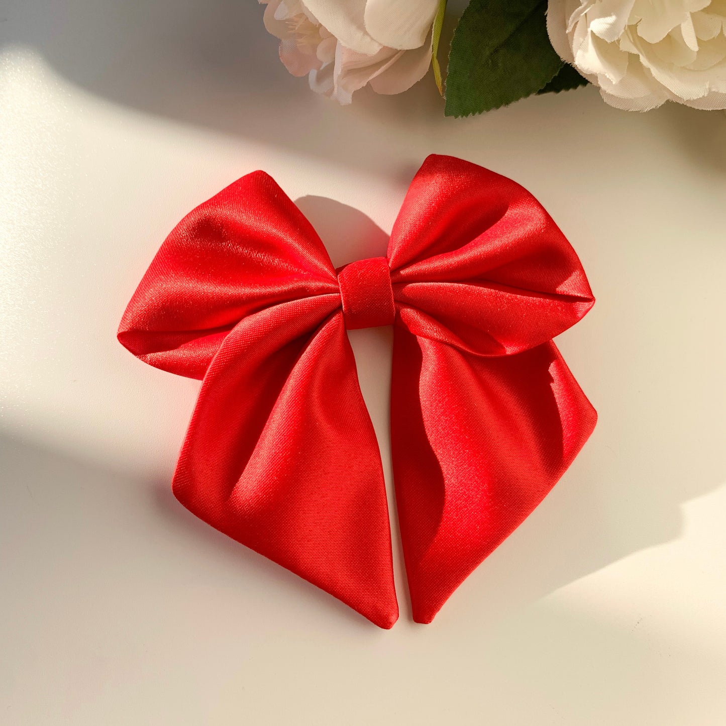 Red satin sailor bow